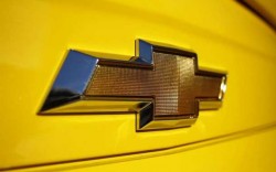 A Chevrolet logo is displayed on a vehicle at Courtesy Chevrolet dealership in Phoenix