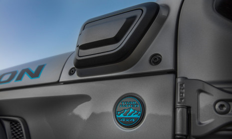 The charge port on the 2021 Jeep® Wrangler 4xe is mounted on the left cowl. The charge port is covered with a push open/push close door.