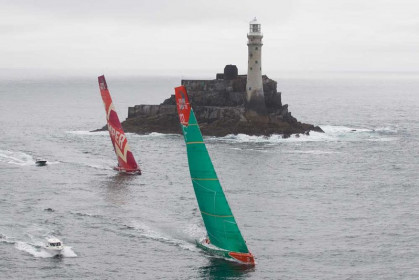 Groupama Sailing Team, skippered by Franck Cammas from France and CAMPER with Emirates Team New Zealand, skippered by Chris Nicholson from Australia, rounding Fastnet Rock, on leg 9 of the Volvo Ocean Race 2011-12, from Lorient, France to Galway, Ireland. (Credit: IAN ROMAN/Volvo Ocean Race)